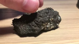 Close up look at a loadstone (natural magnet)