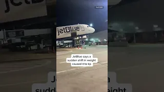 A plane tilts back as passengers disembark at JFK