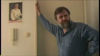 Why does Slavoj Zizek have a Stalin poster on his wall?