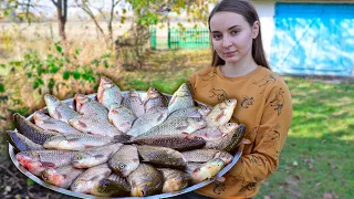 Sour cream carp recipe in Ukrainian village, Woman cooking grilled fish