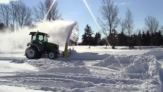 John Deere 3720 Blowing Snow