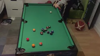 Son vs father in mini table pool