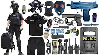 Unpacked special police weapon toy set, UZI submachine gun, Glock pistol, gas mask, bomb dagger