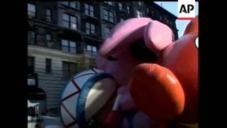 Unseasonably balmy weather greeted enthusiastic crowds as the giant balloons in the traditional Macy