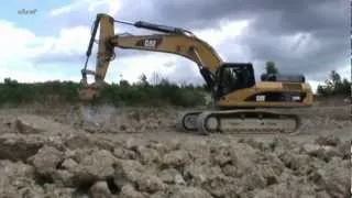 Экскаватор с рыхлителем CAT 330 DL.