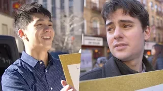 White guy and Asian guy compete for free hugs. The results shocked them both.