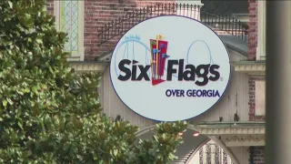 Guests react after shooting near Six Flags Over Georgia