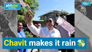 Chavit Singson gives away money with gold cashgun