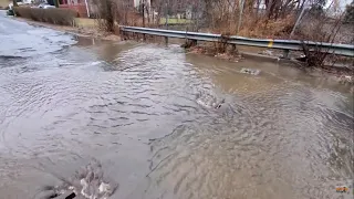 Over Capacity Culvert Flooding Over Street, With Drainage Whirlpools