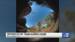 Police officer's body camera captures train striking him