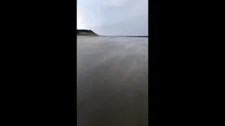 Powerful winds sweep across Northern Irish beach