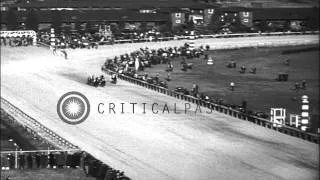 Spectators in a stand watch Washington Handicap horse race as War Admiral wins th...HD Stock Footage