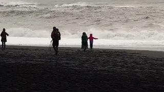 Iceland Tourists at the Famous Deadly Black Beach