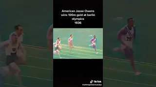 Jesse Owens wins 100m gold medal at Berlin Olympics in 1936.