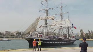 Ship that will carry the Olympic flame from Greece to France moors in Piraeus