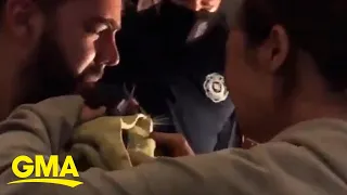 The emotional reunion between a missing cat and owners following a house fire l GMA