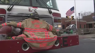 Firefighters salute Jason Arno's funeral procession at Engine 2