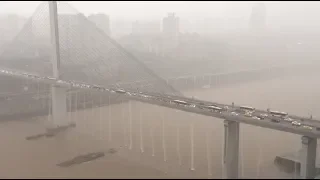 Heavy Rain Creates Cascades on Bridge in southwest China