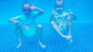 Gaby and Alex learning how to swim and having fun in a swimming pool