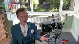 Owain Wyn Evans playing the drums on BBC Breakfast