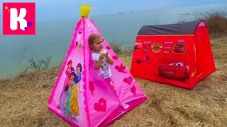 Max and Katy with tents on a picnic at the sea