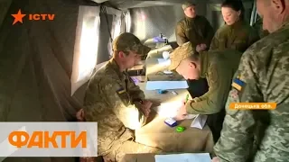 В армейской палатке, но без очередей: как голосуют военные на Донбассе