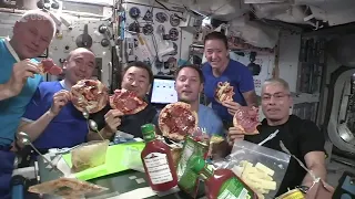 Astronauts have a pizza party in space