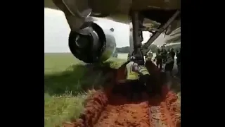 Airplane skids off runway and gets stuck in the mud in Lagos Nigeria