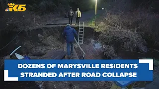 Dozens of residents near Marysville stranded after their only road collapsed under water pressure