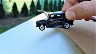 Welly cars in 1:60 scale slide down the board