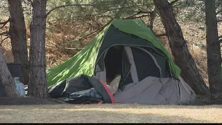 Fencing goes up around homeless camp ahead of March Madness