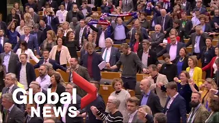 European Parliament members sing 'Auld Lang Syne' after ratifying U.K. Brexit deal