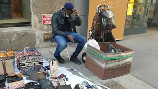 Walking up 5th Avenue in New  York City checking out Street vendors selling imitation designer bags