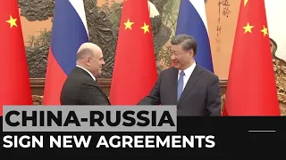 Russia, China sign new agreements, defying Western criticism