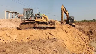 Dump truck and bulldozer shantui