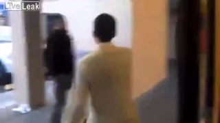 Angry Guy Punches Cameraman Through Glass