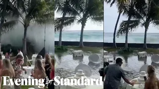 Watch: moment towering waves in Hawaii crash into a wedding venue