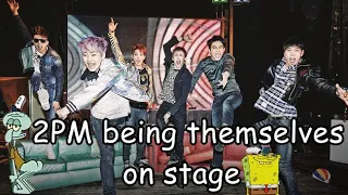 2PM being themselves on stage.