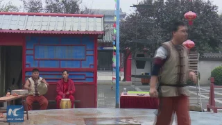 Qigong master swallows steel ball and spits it out