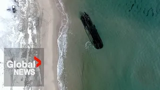 Mysterious shipwreck washes ashore in eastern Canada coastal community