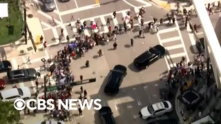 Trump motorcade leaves courthouse after arraignment in Miami with supporters alongside