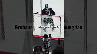 Philipp Grubauer waving at a young fan