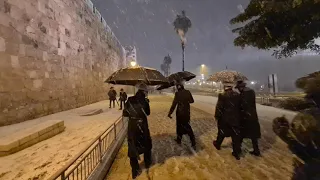 Watch: Rare snowfall blankets Jerusalem's Old City walls and the new city - ASMR