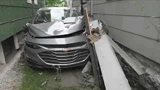 Mystery shrouds car wedged between two Buffalo homes