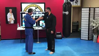 Chest grab defense against a strong opponent