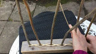 Willow weaving a mini hurdle