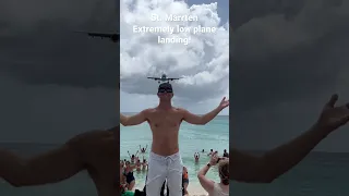 A must see!  Extremely low plane landing! Saint Maarten! Standing on the beach!