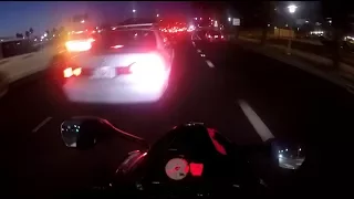 Careless driver changes lane cutting off biker