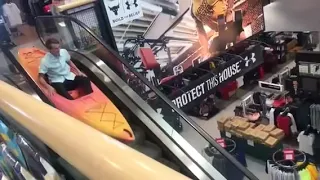 Kayaking Down Escalator at Richard’s Sporting Goods.