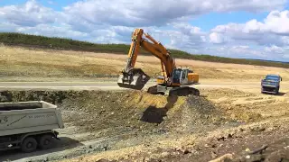 Liebherr R964C loading MB Actros dump trucks